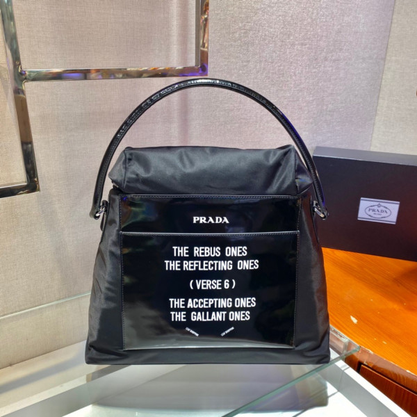 Pra*a signaux nylon and leather hobo bag
