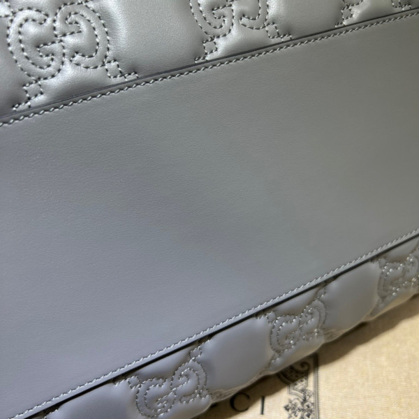 G*u*i gg matelassé leather top handle bag