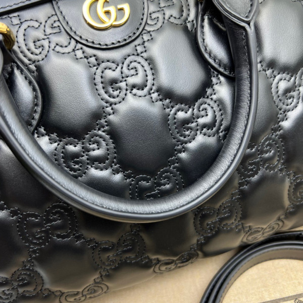 G*u*i gg matelassé leather top handle bag