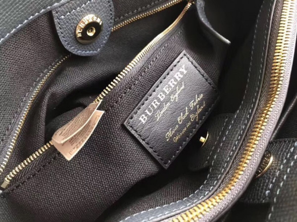 B**rry the medium banner in leather and house check