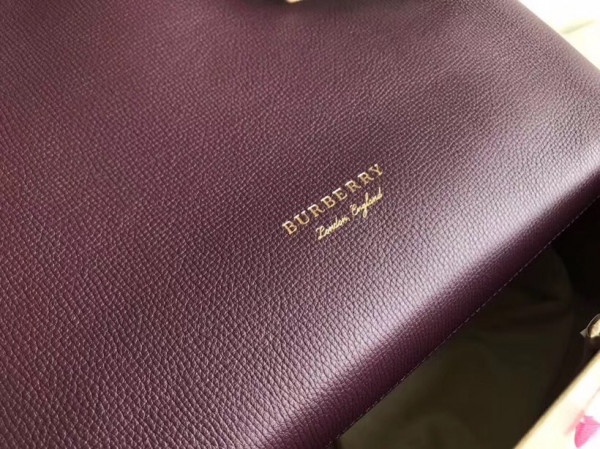 B**rry the medium banner in leather and house check