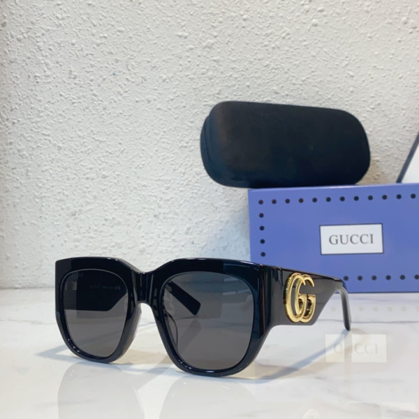 G*u*i sunglasses